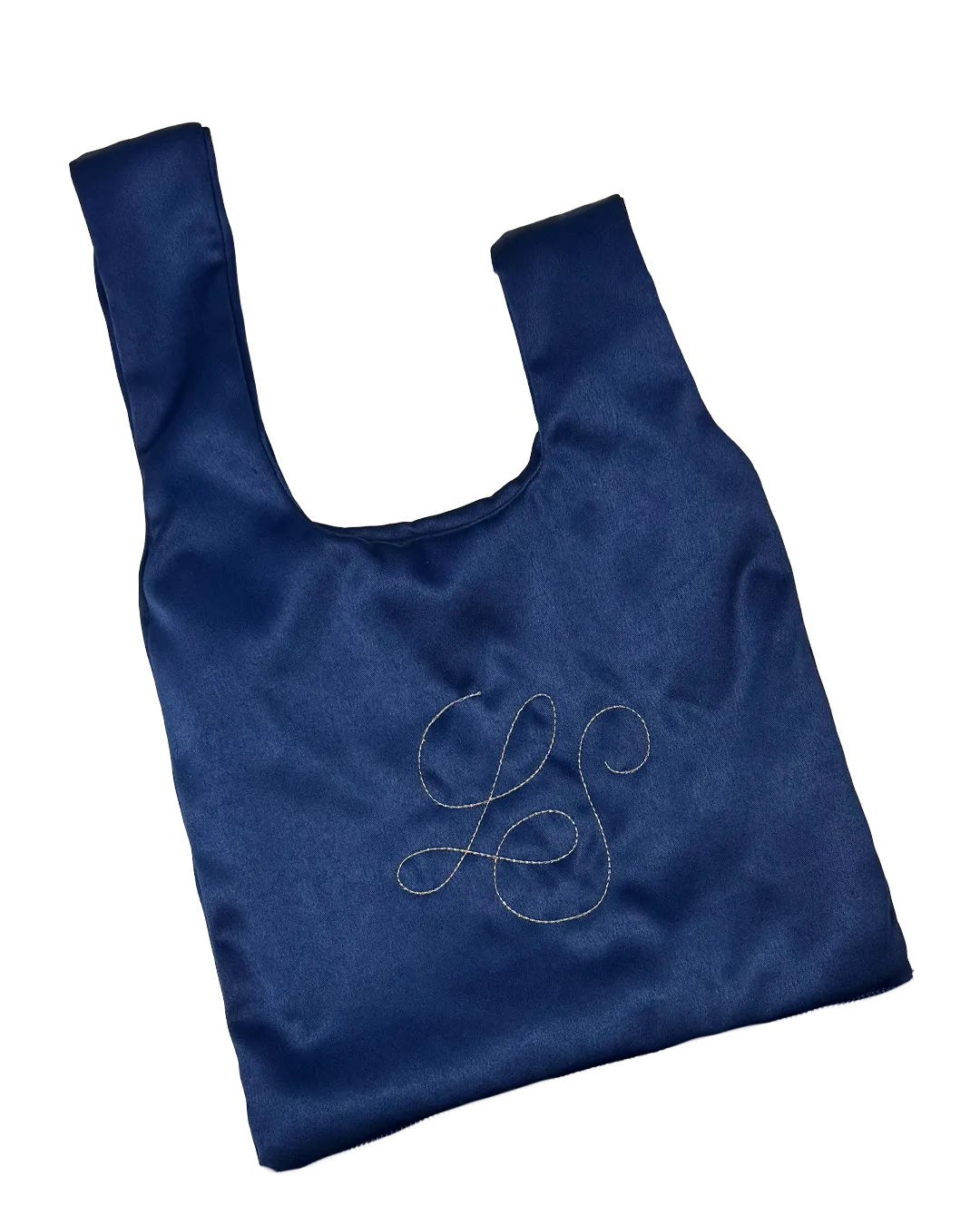 LS monogram embroidered in calligraphy on the navy satin of a Knot Bag